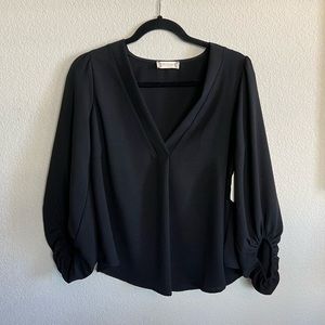 Black balloon sleeve top